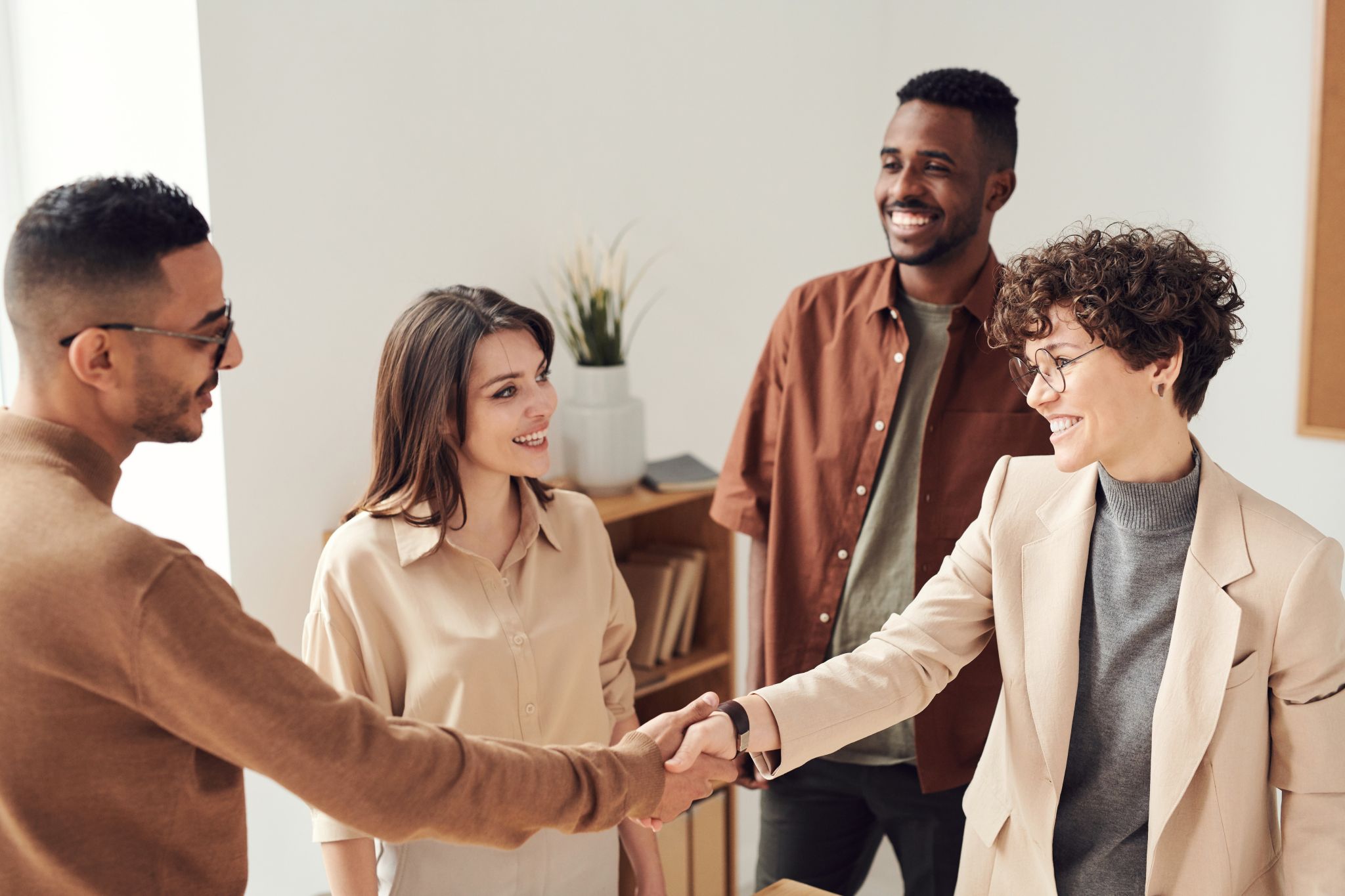 Photo of people in the workplace having an agreement