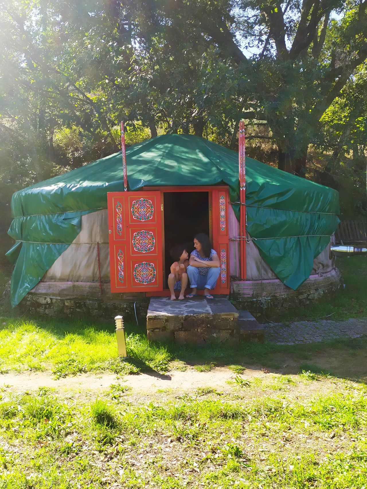 Photo of me with my kid at a camping site, talins to each other